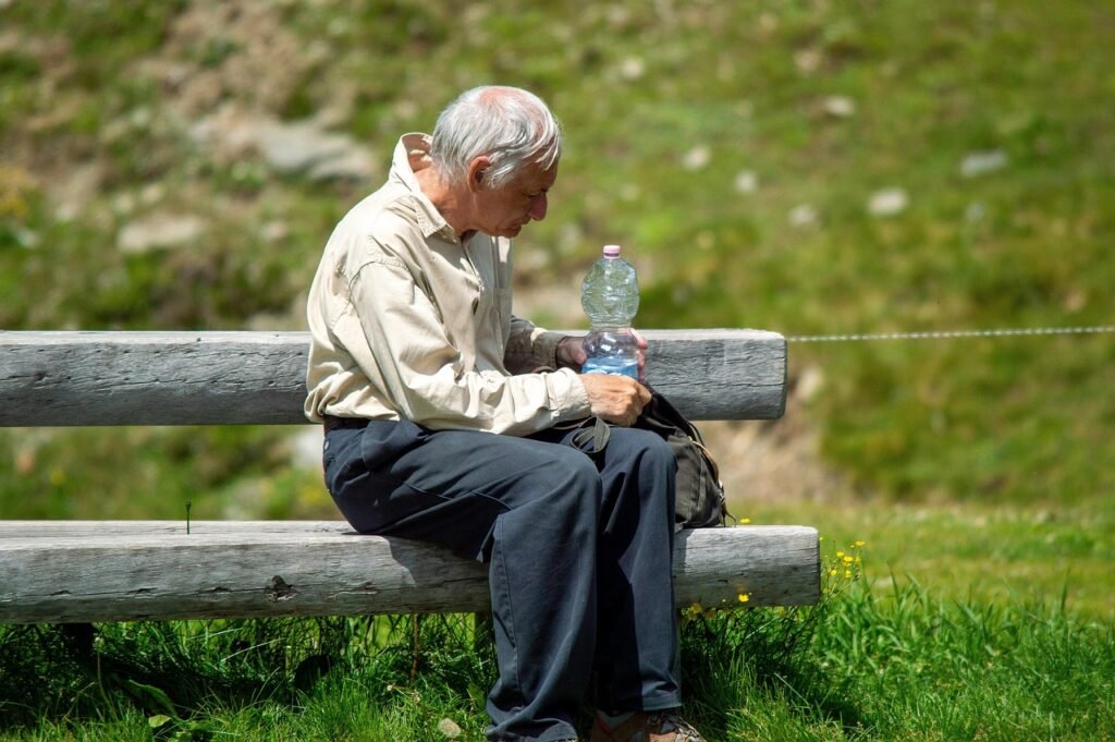 Old man drinking water